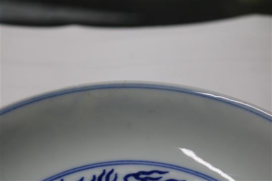 A Chinese blue and white dragon dish, diameter 16.3cm, some damage